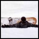 thumbnail Tahoe Heavenly snowboarder laying down