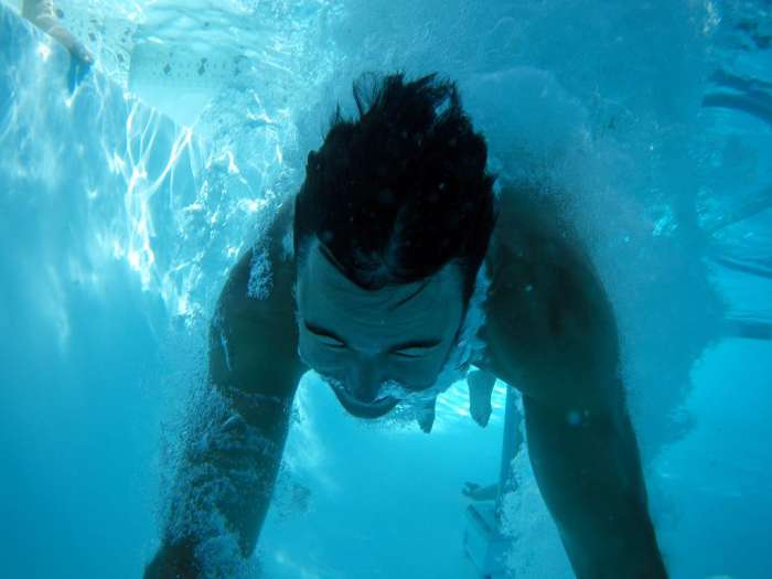 Pool dive under water bubbles