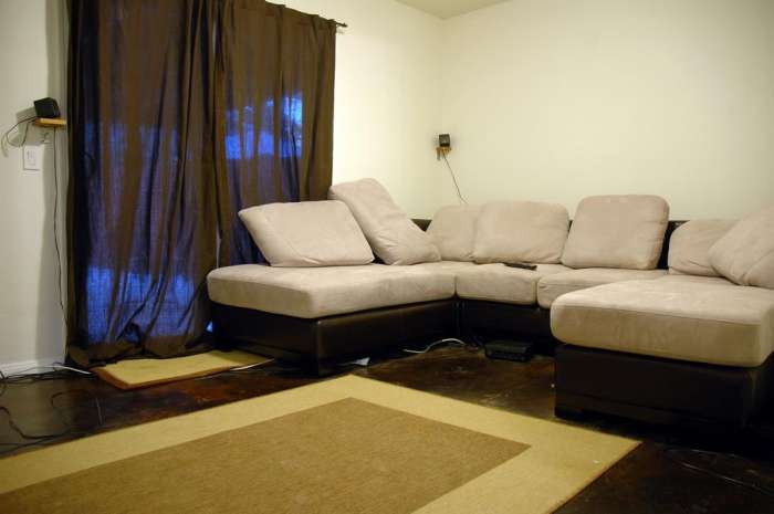 Renovation media room couch sectional sound system polished concrete floor