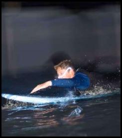 Night surf nightsurf paddle low light blur wavestorm