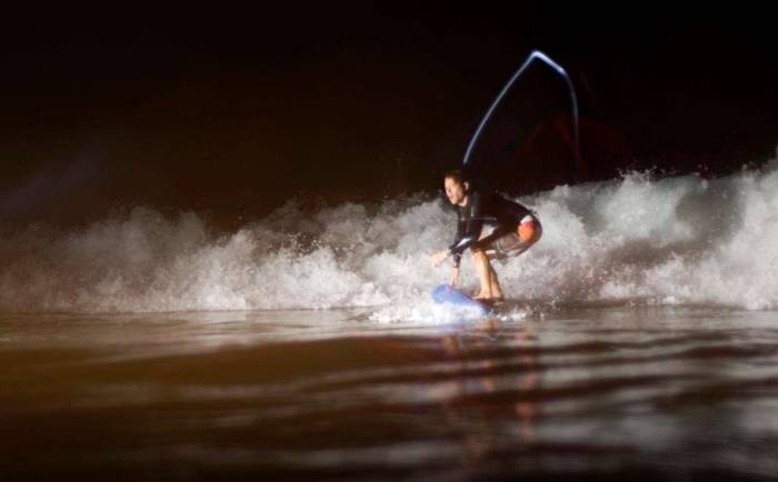 Surfing nightsurfing glow stick ride whitewater