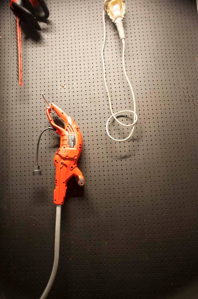 Pegboard painted tool tool storage hedge trimmer light weed whacker