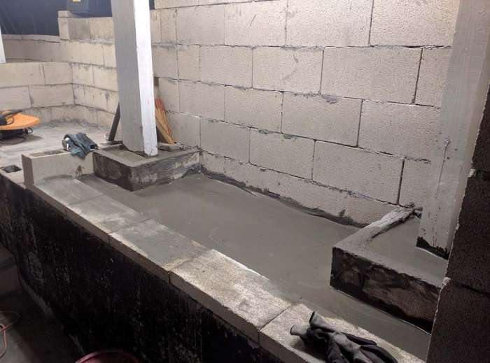 Murder room cinder block tool storage concrete pour