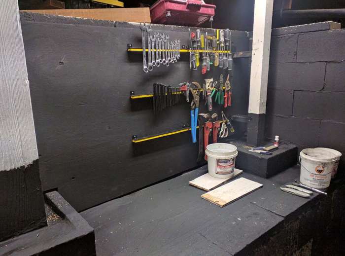 Murder room concrete pour cinder block magnetic tool storage