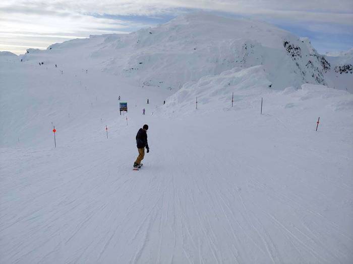 Whistler peak saddle snowboarder snowboarding skiing
