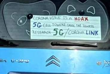 Coronavirus covid hoax car sign 5G cell tower
