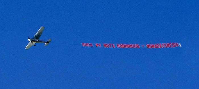 Reddit WallStreetBets GME Suck my nuts Robinhood airplane banner