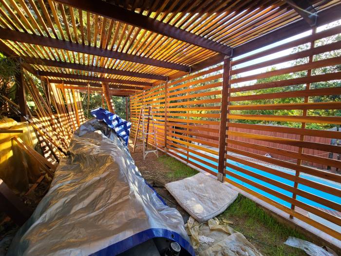 Backyard veranda structure horizontal slats redwood terrace