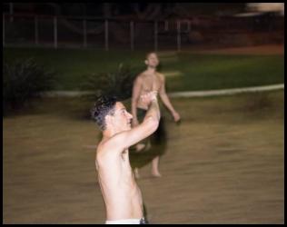 Volleyball night motion blur sand