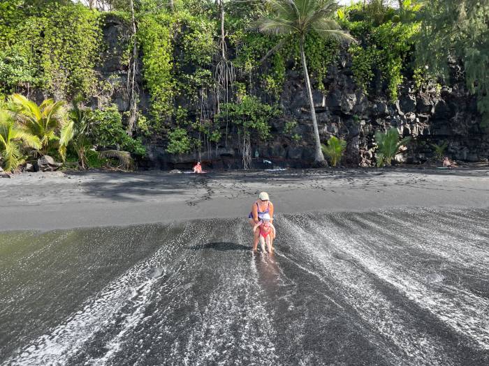 kehena black sand beach shore cliffs