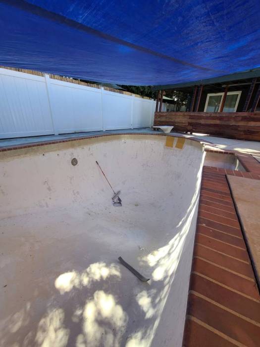 Fiberglass in-ground pool resurface prep drain tarp
